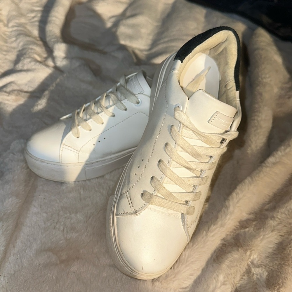 Kurt Geiger white sneakers with black trim on heels. Size 6
